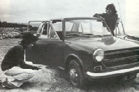 Black and white photo of car.