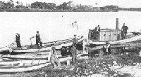 Black and white photo showing people on ship. Black and white photo showing people on ship.