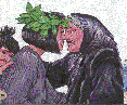 Woman with leaves in her hair and woman with a headscarf hongi.