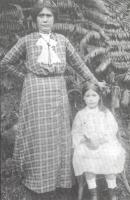Black and white photo showing woman and child.