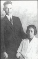 Black and white photo showing man and woman.